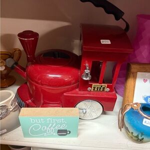 Red Train-Shaped water boiler for your tea or instant coffee.